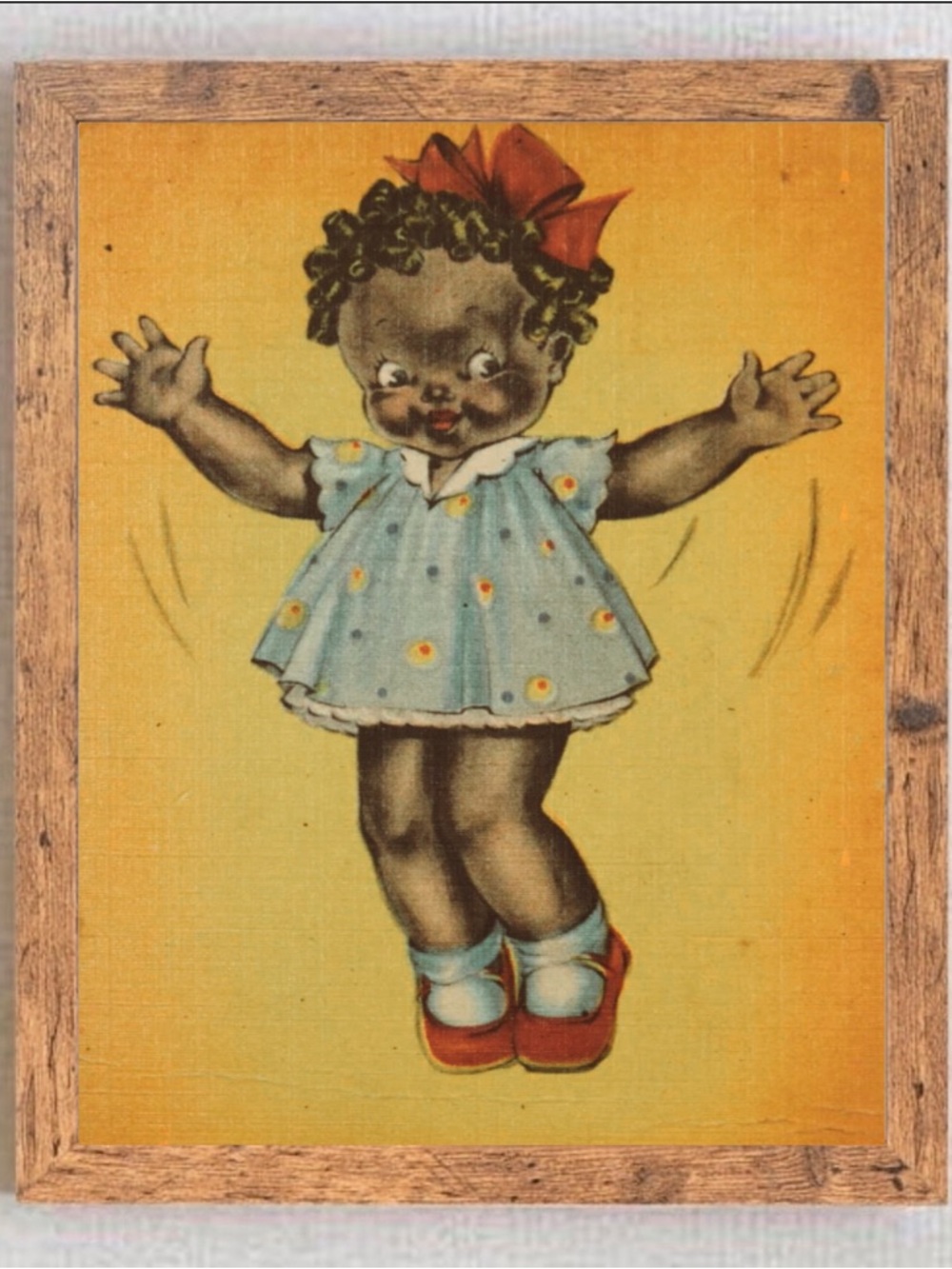 Illustration of a Black Doll in Blue Dress with Red Bow